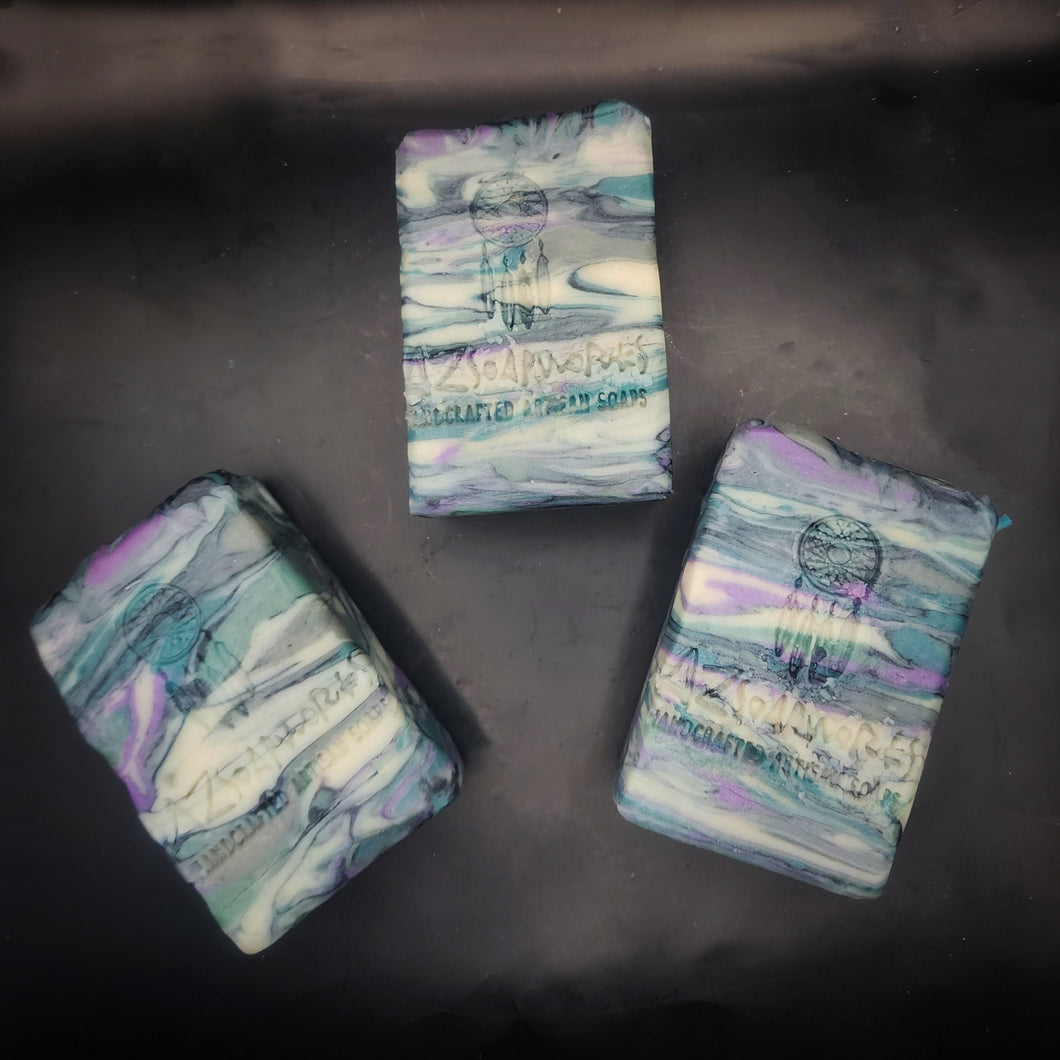 Handmade soap from Arizona featuring deep forest green, royal purple and charcoal black highlights. 