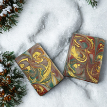 Holiday Cabin Soap featuring two bars of soap against snowy backdrop