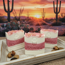 Three bars of soap with a desert sunset and cacti in the background