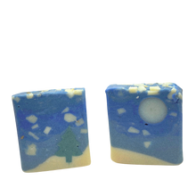 Two square soap bars with a blue and white design on a white background